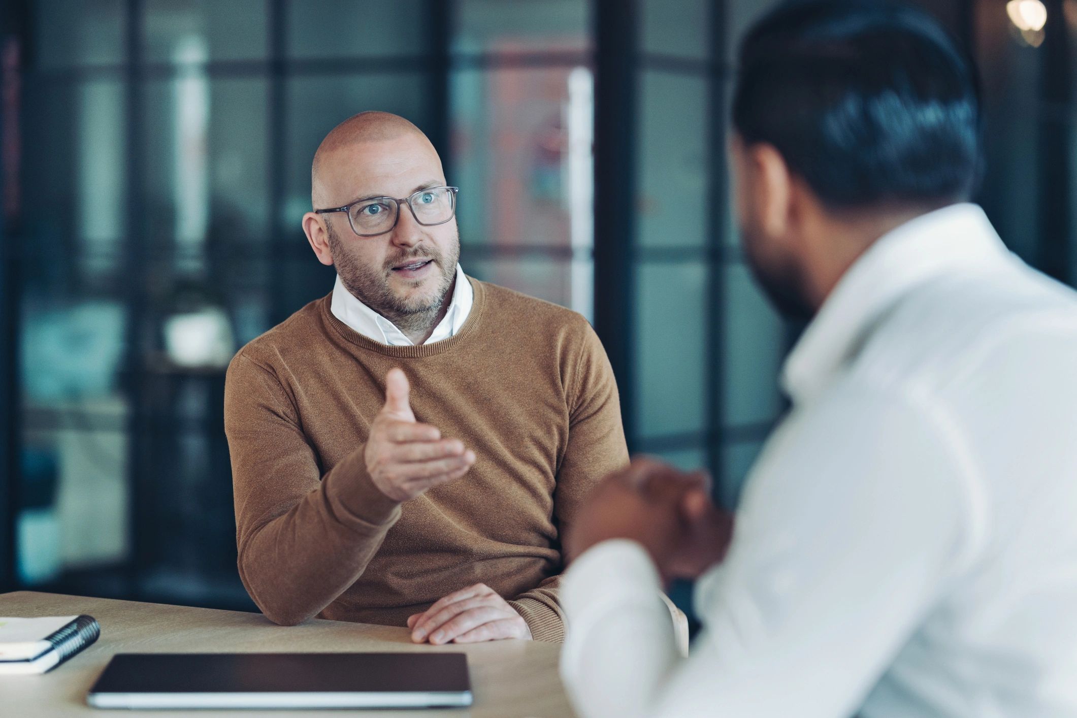 Advisor presenting financial concepts during a client meeting